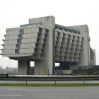 Geometric Concrete Building in Urban Misty Landscape