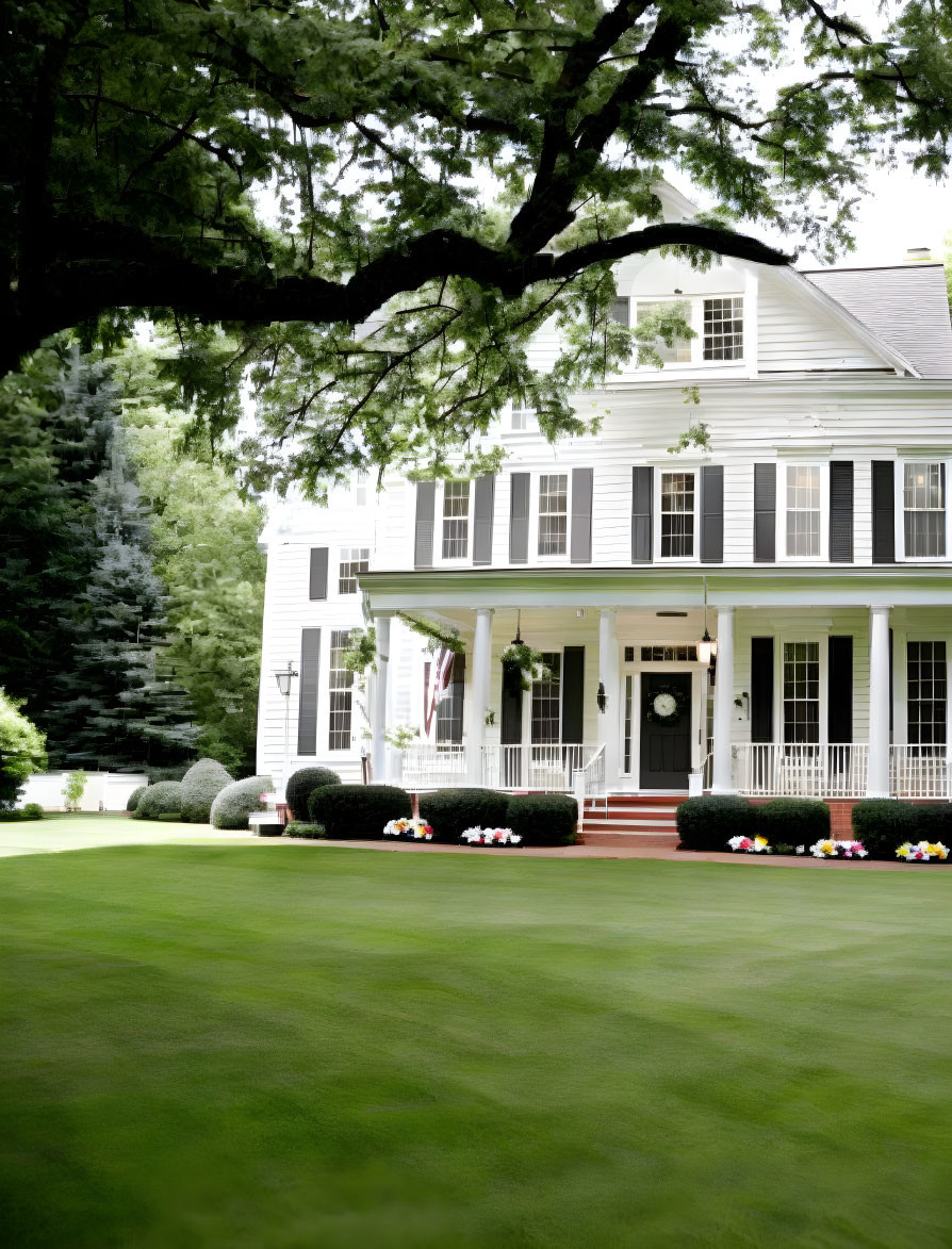 White Two-Story House with Front Porch and Lush Green Lawn