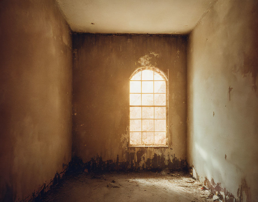 Dusty room with grid window and peeling walls