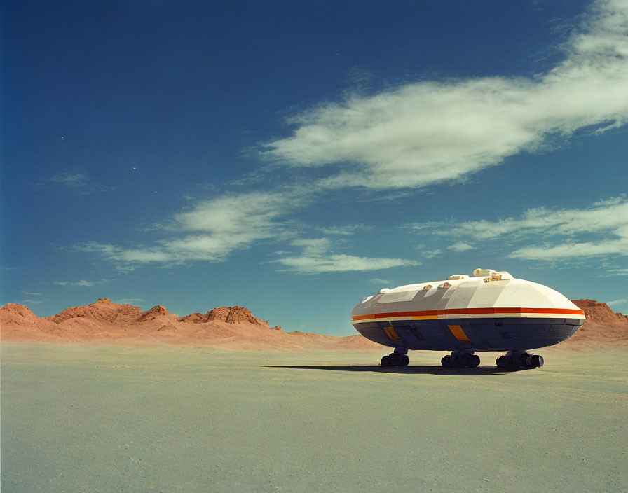 Futuristic white and orange vehicle in desert landscape