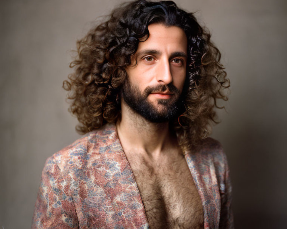 Curly-Haired Man with Beard in Paisley Jacket Portrait