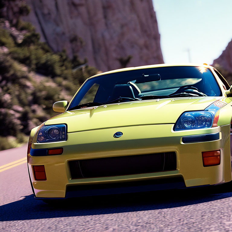 Yellow sports car speeding on sunny road with rocky cliffs