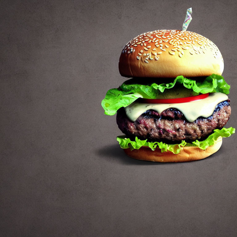 Classic Cheeseburger with Lettuce, Cheese, Tomato on Sesame Seed Bun on Dark Background