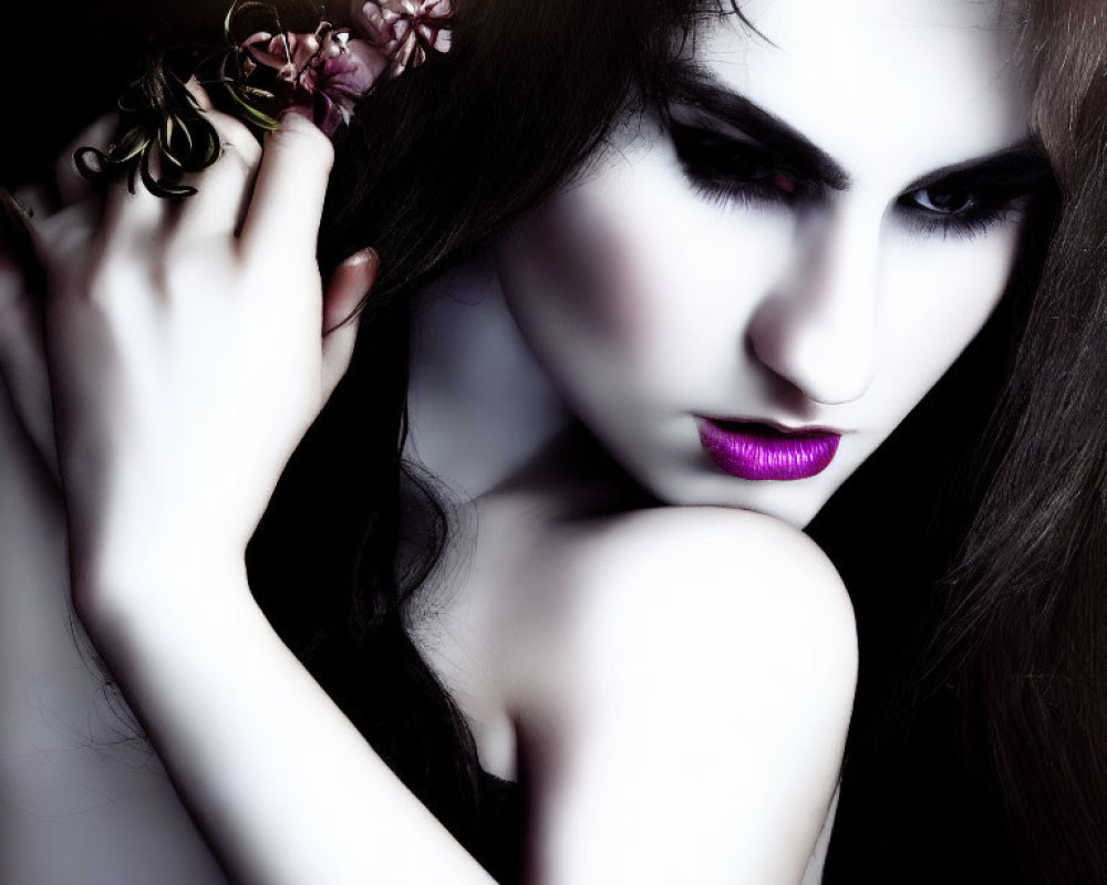 Dark-haired woman with purple lipstick holding flowers for a dramatic look