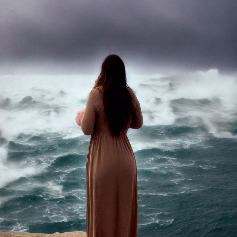 Woman in Beige Dress on Cliff Overlooking Stormy Sea