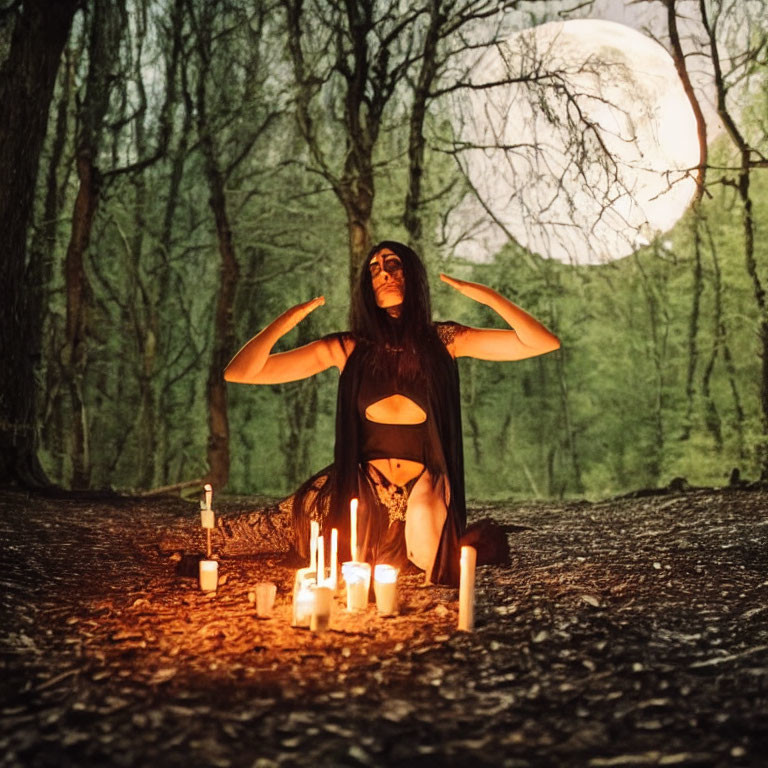 Person in mystical attire surrounded by candles in forest at night with full moon