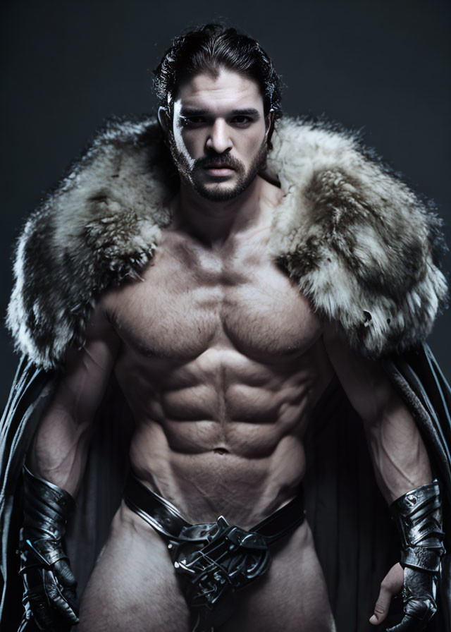 Fantasy warrior in fur cloak and leather gauntlets on dark background