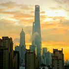 Futuristic city skyline at sunrise with towering skyscrapers