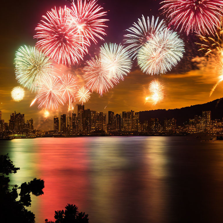 Colorful fireworks illuminate city skyline at night