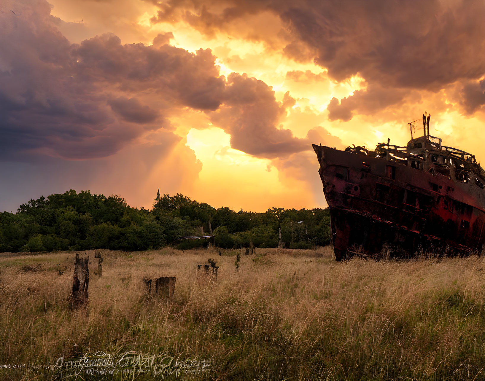 Abandoned shipwreck under dramatic sunset sky