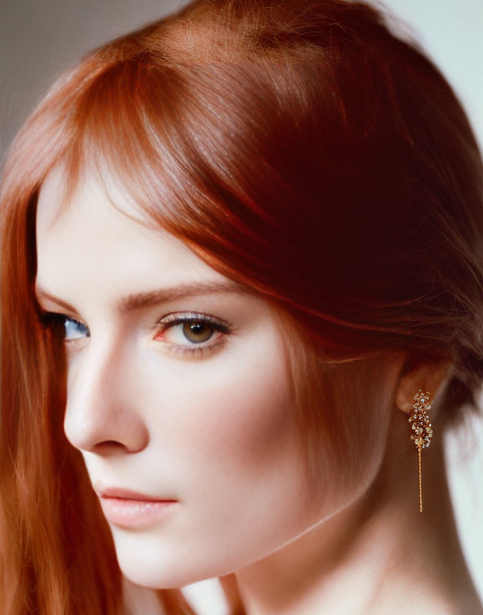 Person with Red Hair, Fair Skin, Earring, Blue Eyes Profile View