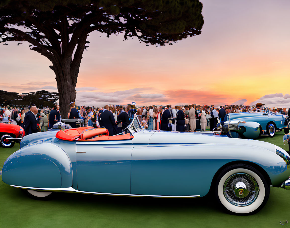 Classic cars and elegantly dressed attendees at vintage car show at sunset