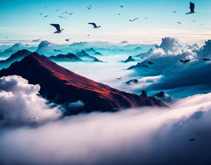 Majestic mountain peaks above clouds with birds in blue sky