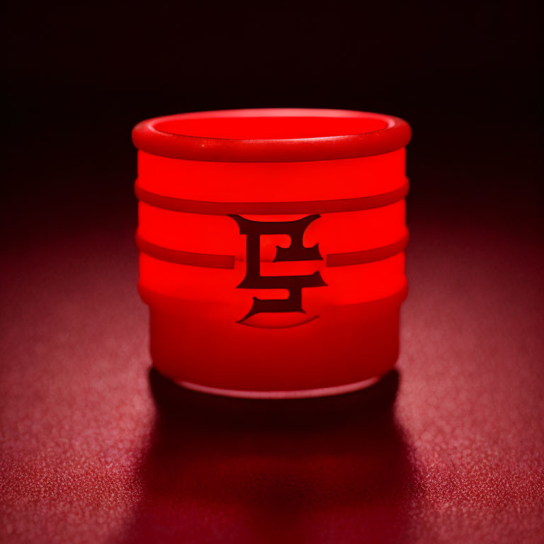 Red cylindrical object with Chinese character on red background