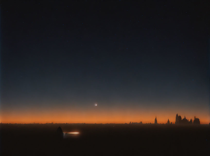 Starry nightscape with silhouetted buildings and orange horizon