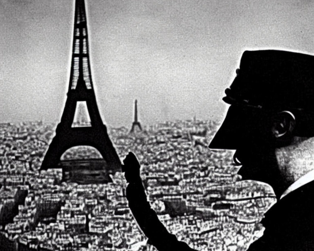 Man's Silhouette Holding Eiffel Tower in Paris Profile Shot