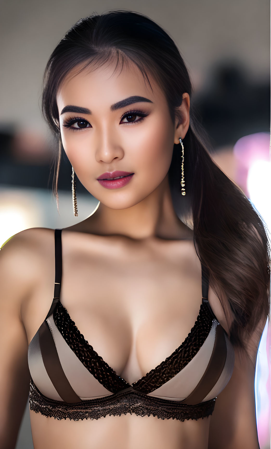 Young woman portrait with long hair and earrings in dark lingerie top