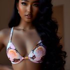 Long-haired woman in floral bikini top with subtle makeup gazes confidently.