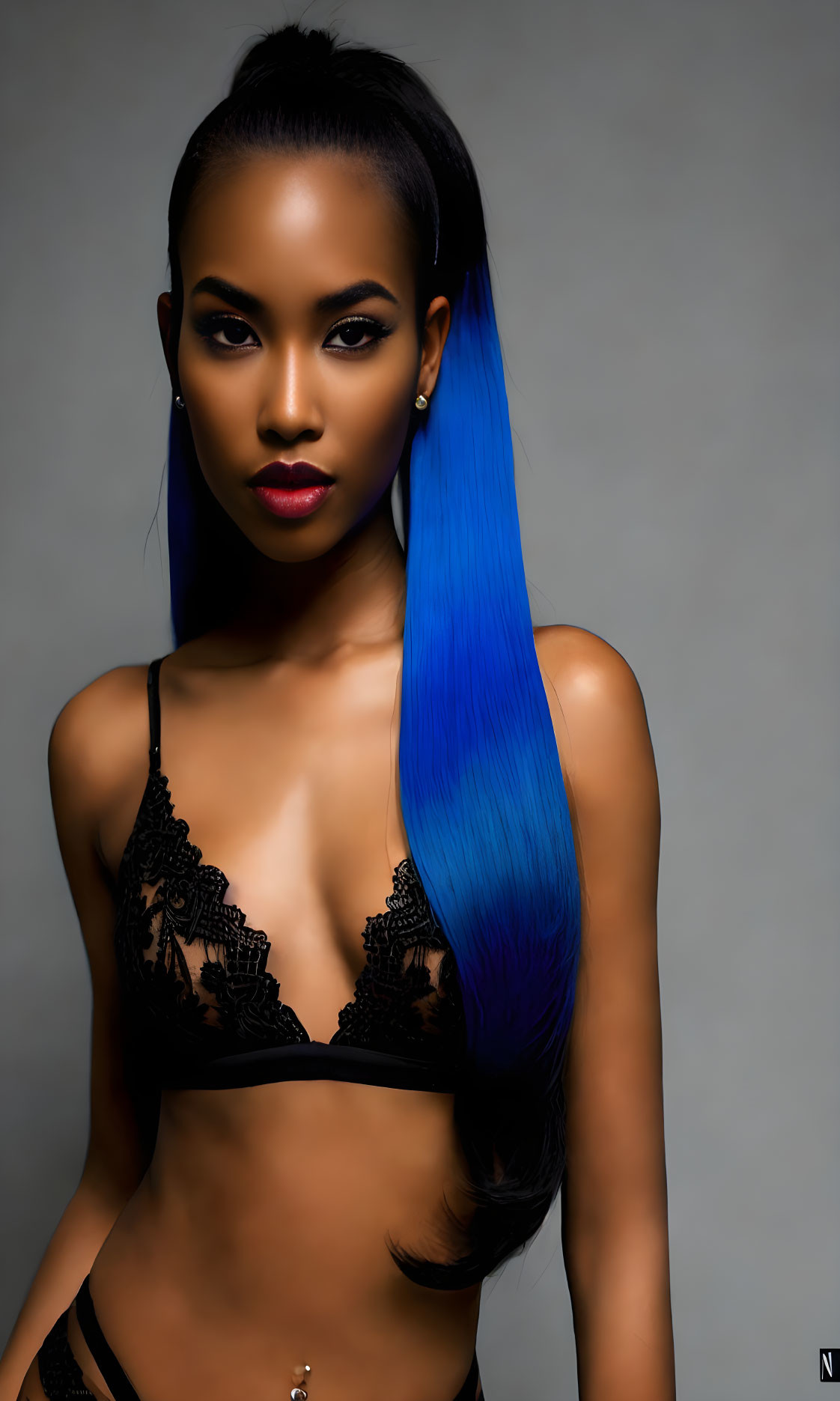 Blue Ombre Hair Woman in Black Lace Bralette on Gray Background