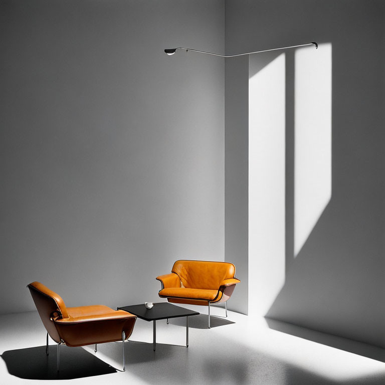 Modern orange chairs, black coffee table, and floor lamp in minimalist grey room