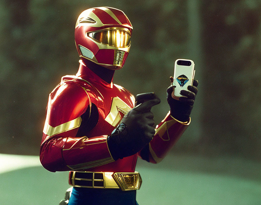 Person in Red and Gold Power Ranger Costume with Smartphone