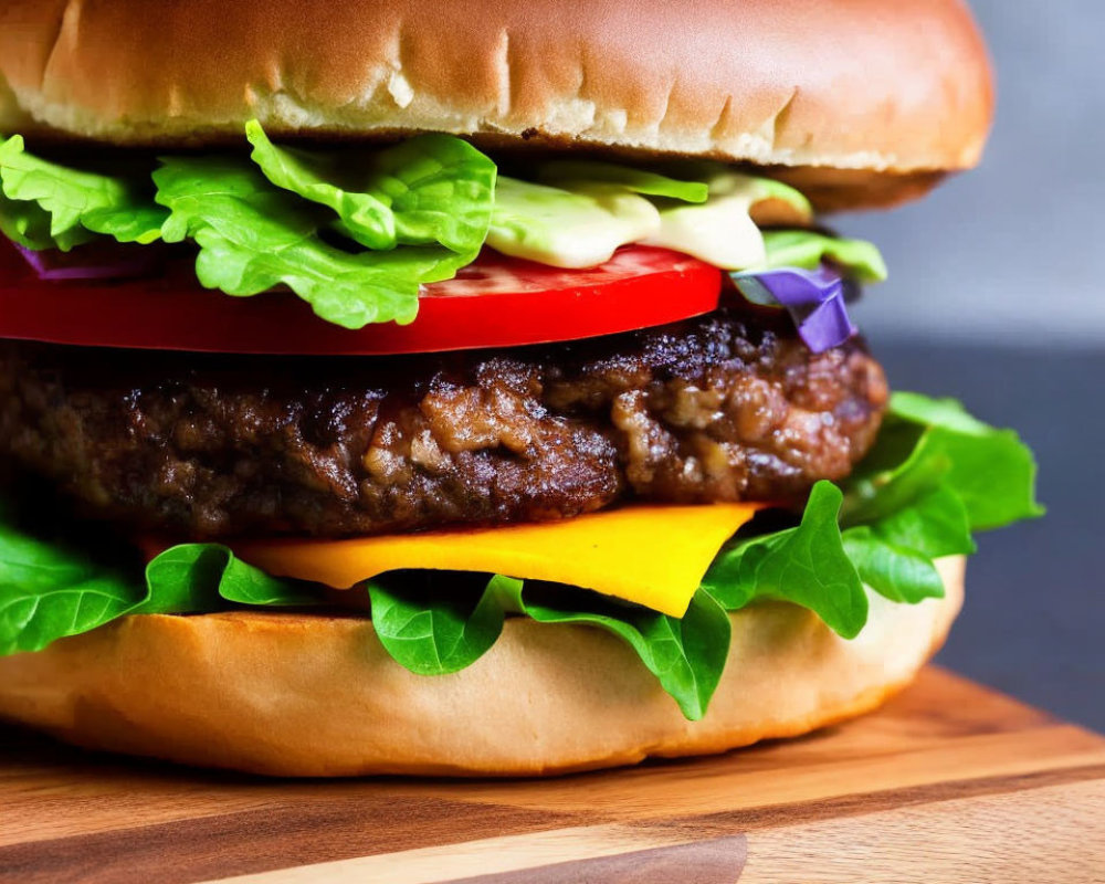 Freshly Prepared Hamburger with Lettuce, Cheese, Tomato, Onions, and Pickles