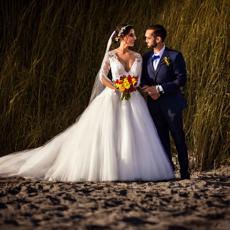 Bride and Groom Embrace on Sandy Beach