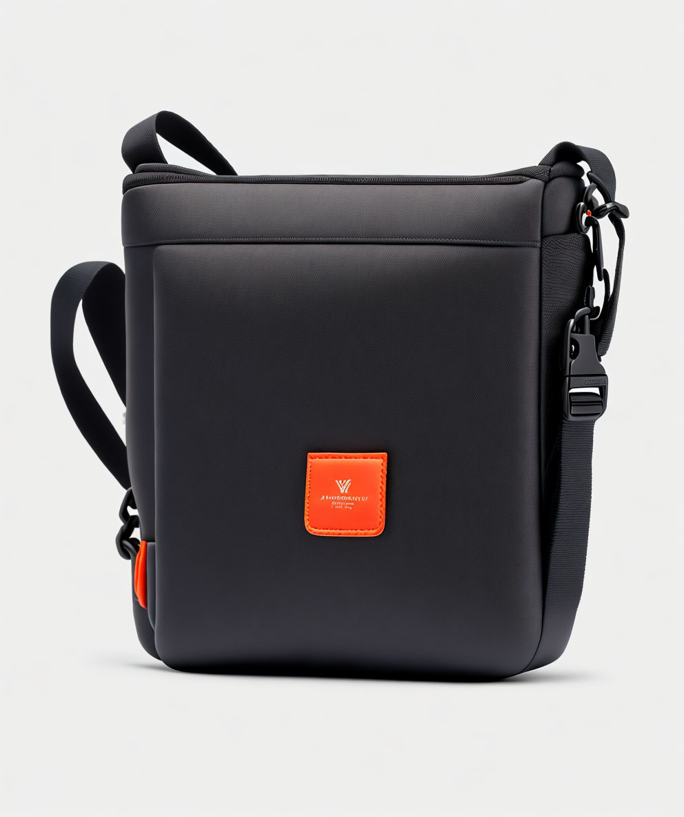 Black Messenger Bag with Adjustable Strap and Orange Brand Logo