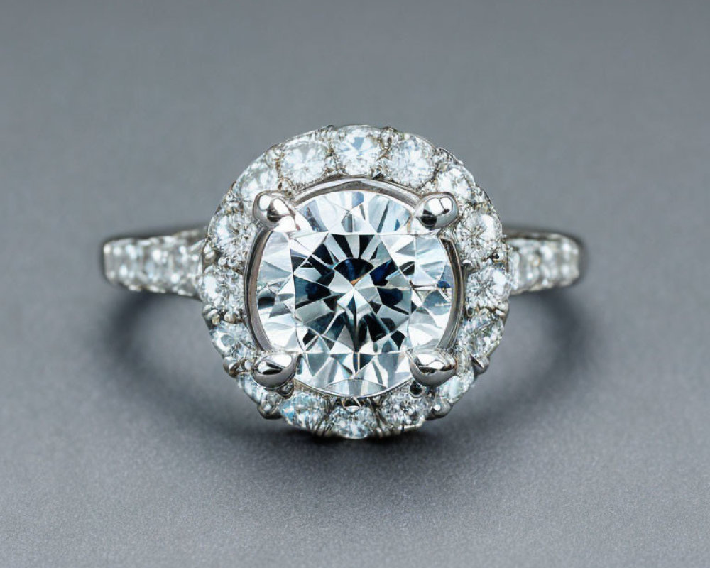 Round-Cut Diamond Ring with Halo Setting and Pavé Band on Grey Background