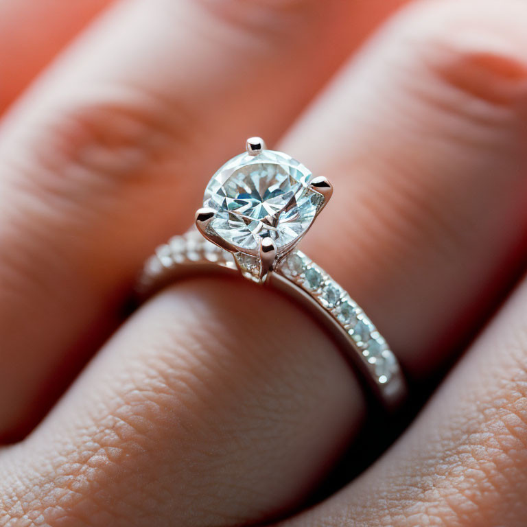 Detailed view of diamond engagement ring with central stone and smaller diamonds on band