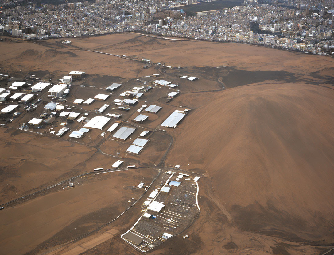 Aerial View of Desert Landscape and Built-Up Area