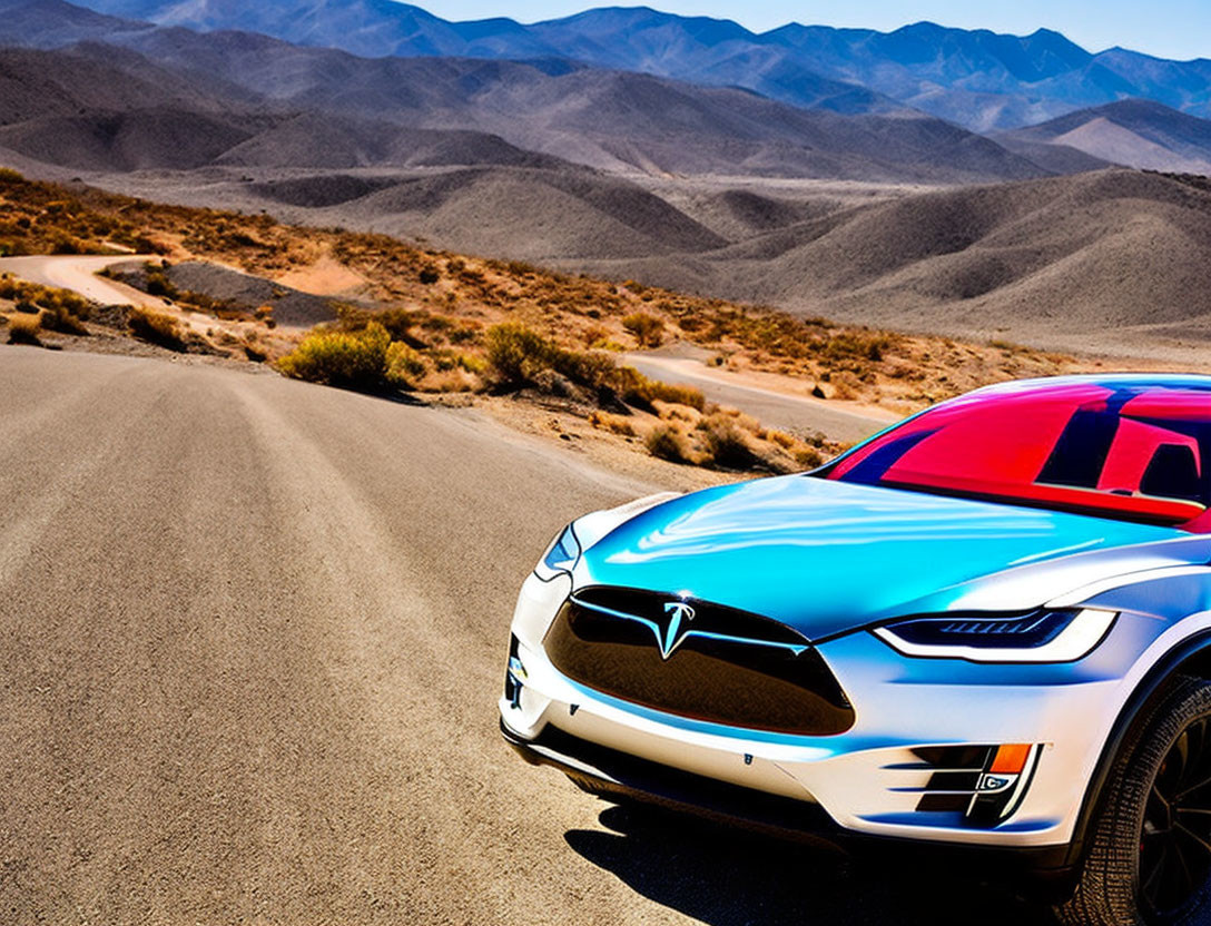 Red Tesla Model S Electric Car Parked on Winding Road Amid Arid Hills