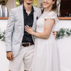 Regal couple in military uniform and lace dress portrait