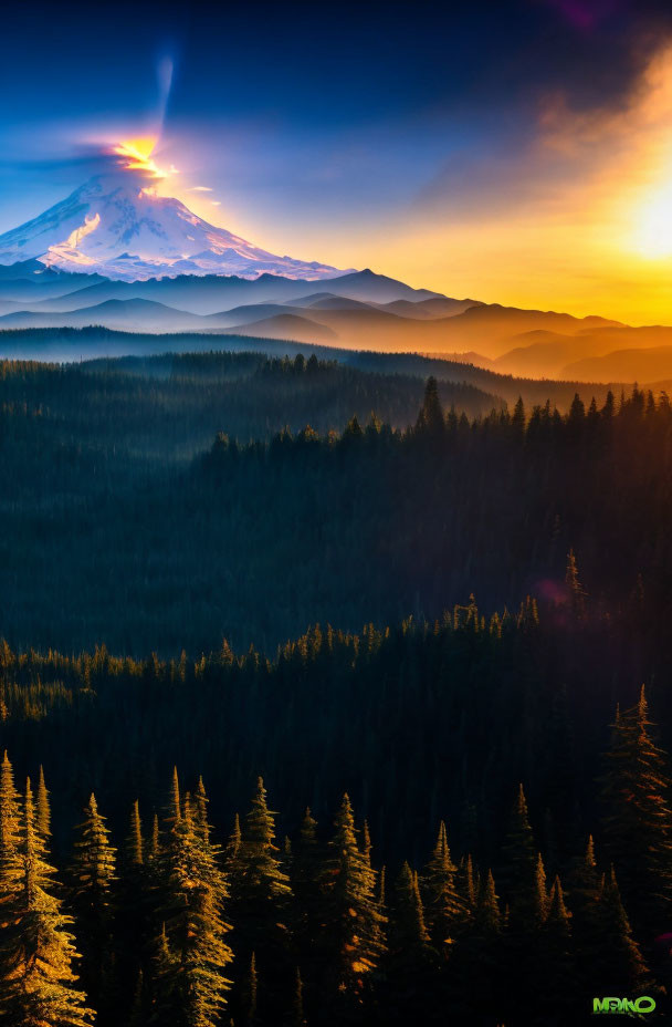 Majestic mountain peak with misty forested hills under vibrant sky