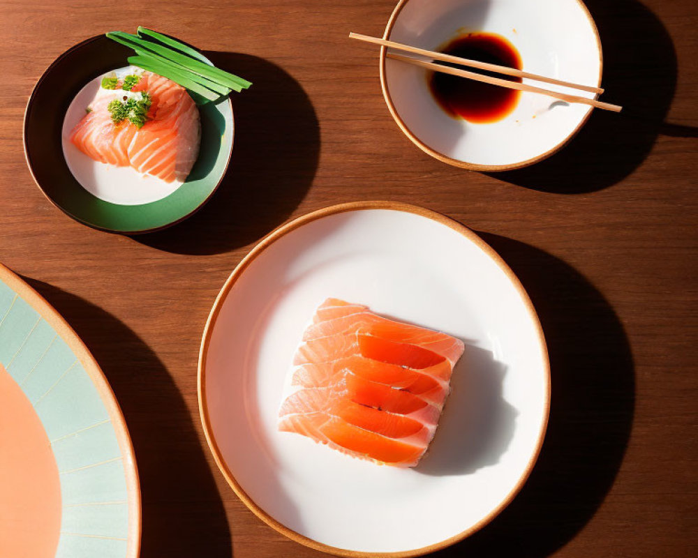 Japanese sushi plates with chopsticks and soy sauce on wooden table.