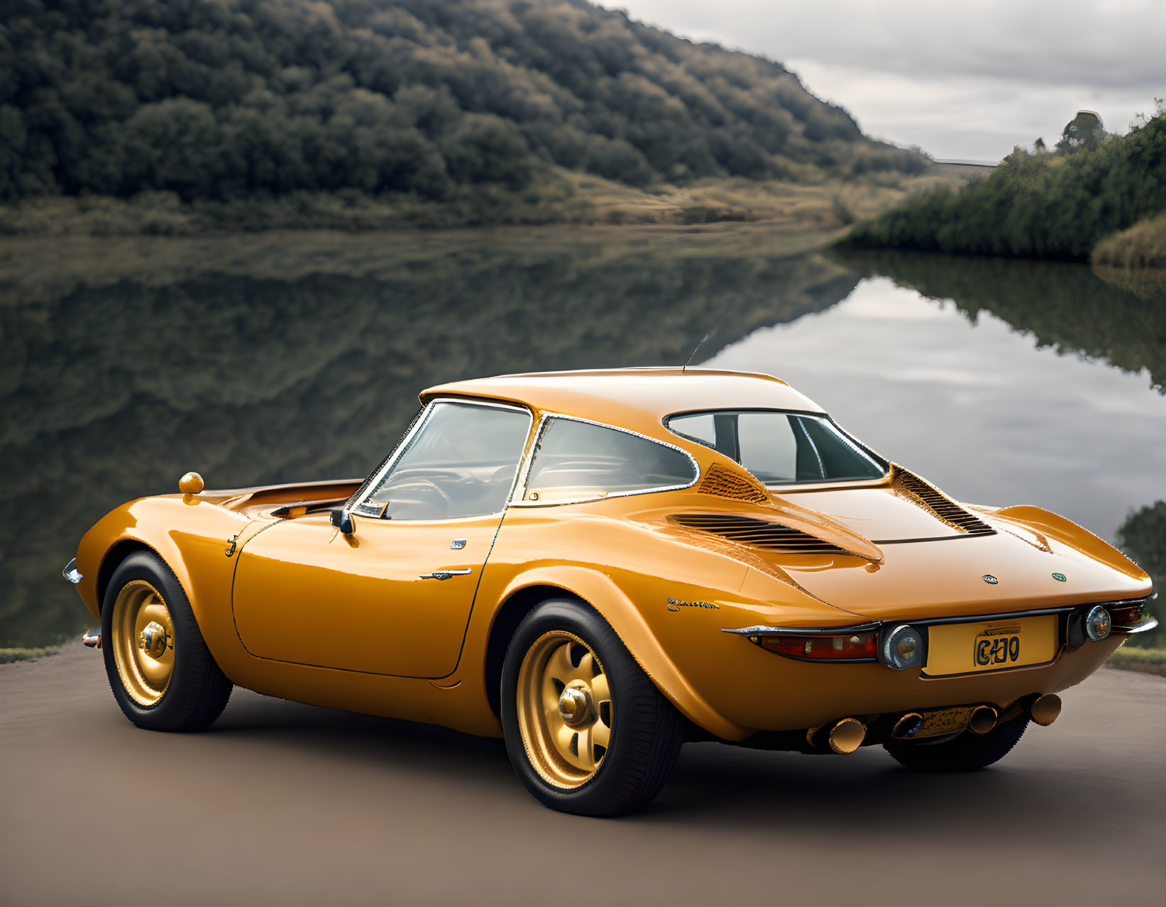 Vintage orange sports car parked near calm lake with golden wheels