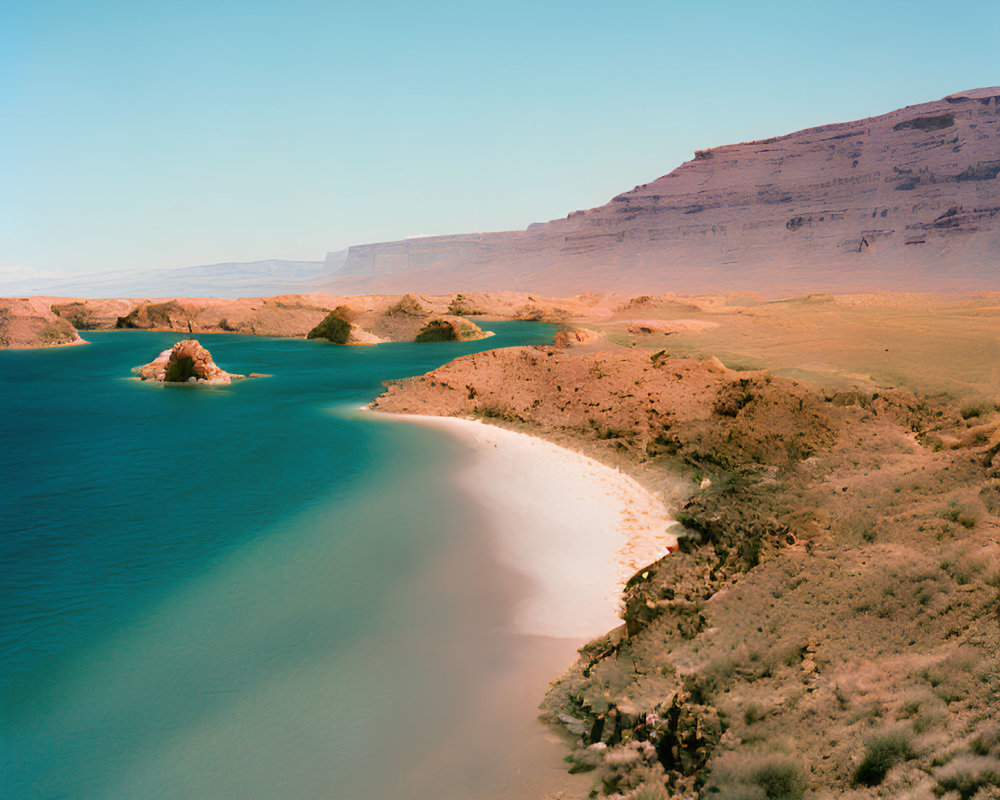 Tranquil turquoise lake with sandy beach and red cliffs