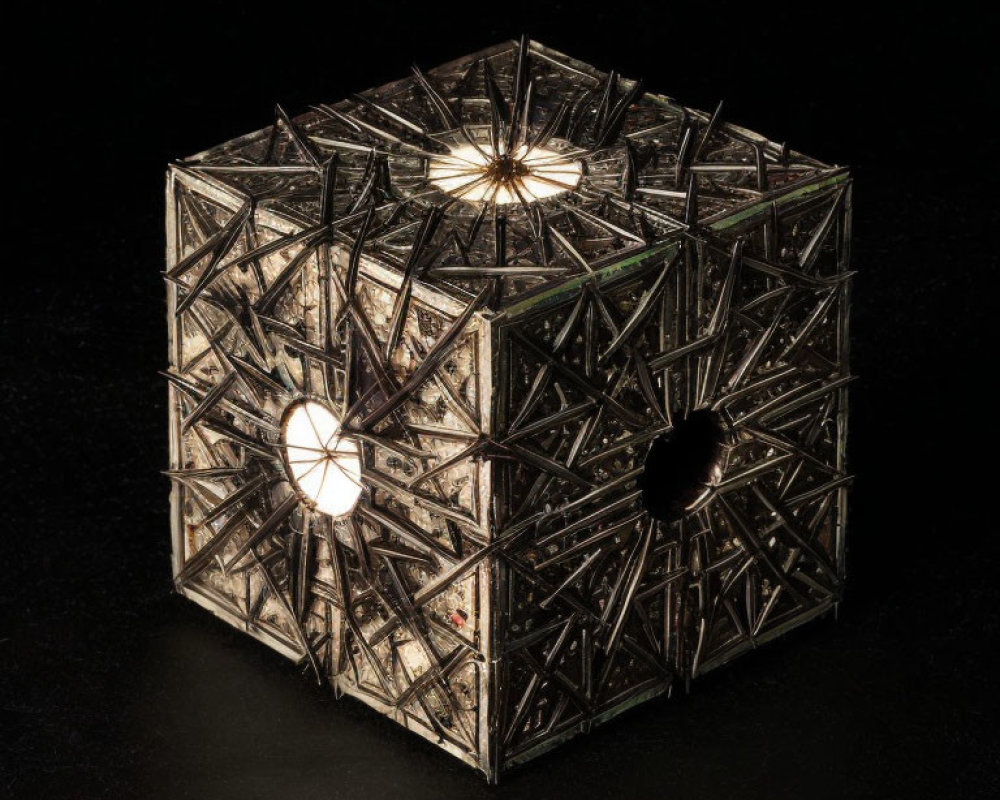 Intricate geometric lantern with cube-like structure and illuminated pattern