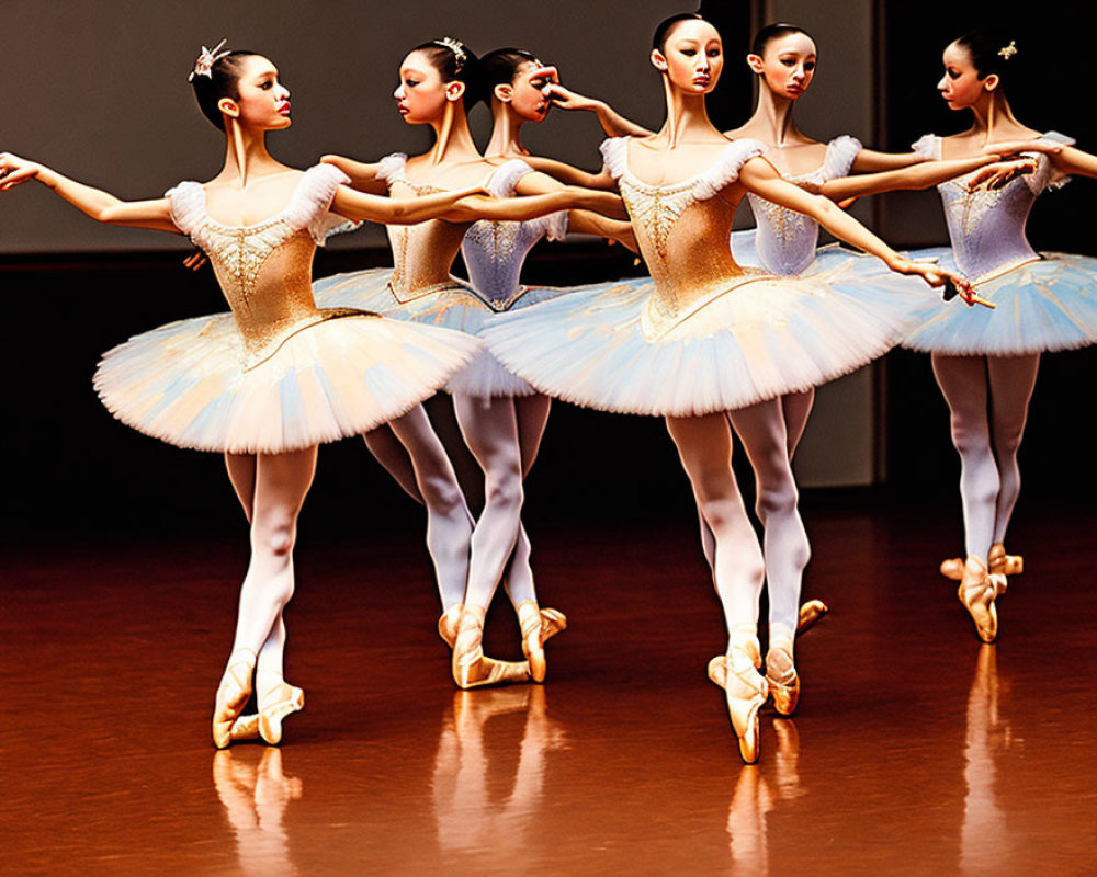 Elegant ballet dancers in sequined tutus and pointe shoes on stage