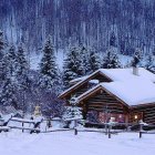 Snow-covered forest cabin at twilight