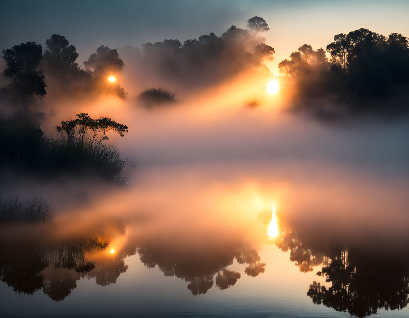 Misty Lake Sunrise with Sun and Tree Reflections