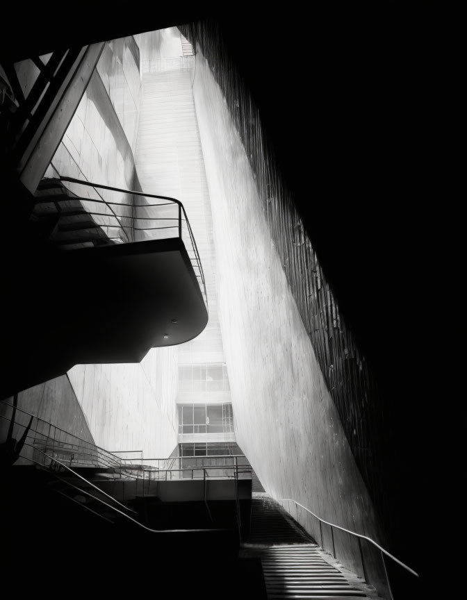 Urban stairwell with angular geometry and light cascading down