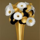 Stylized white and black floral bouquet with gold accents in golden vase on beige background