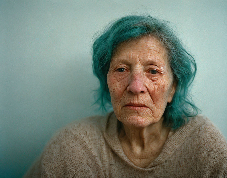 Elderly Woman with Turquoise Hair in Beige Sweater