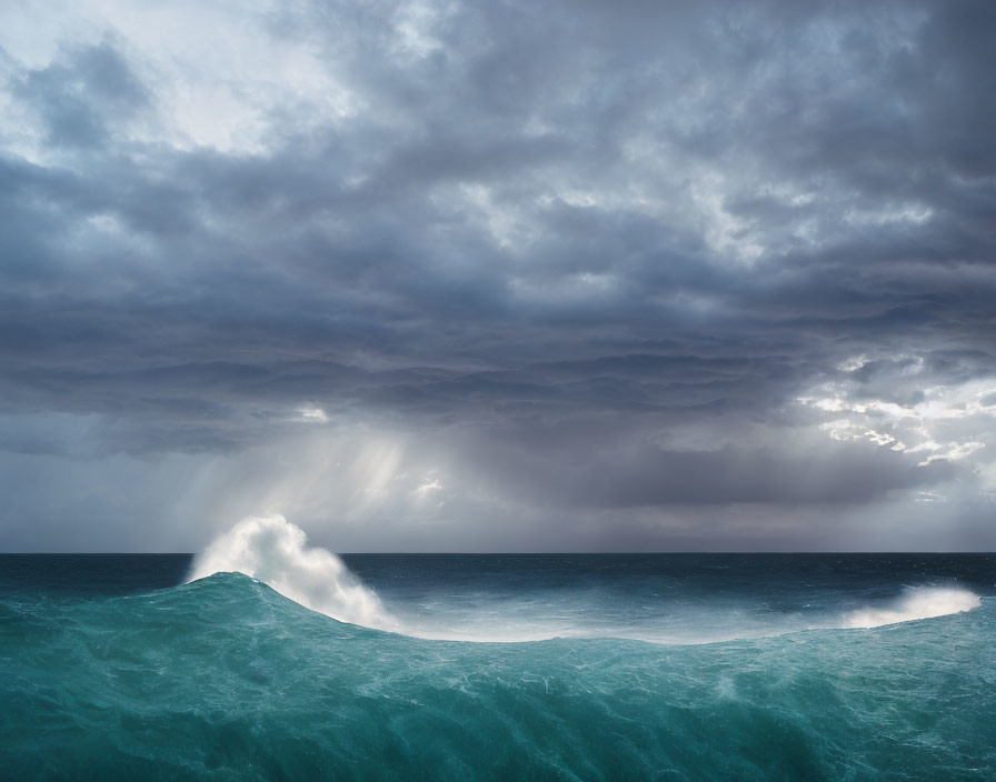 Dramatic ocean scene with cresting wave under cloudy sky