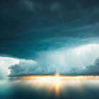 Dark storm clouds and double rainbow over calm seascape.