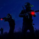 Two soldiers in hi-tech gear at night with flying sharks and glowing embers.