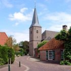 Curved architecture and cobblestone paths in a picturesque village scene