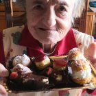 Smiling queen with crown and jewels, accompanied by cheerful ferrets