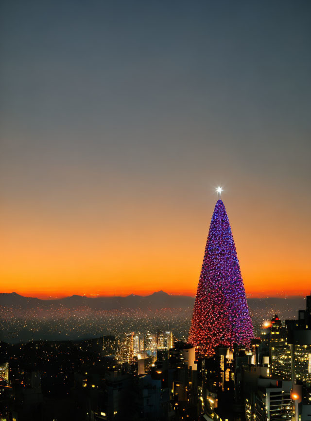 Illuminated Christmas tree in twilight cityscape.